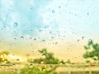 Entering the rainy season. Drive a car on a rainy day. rain drops on the window.