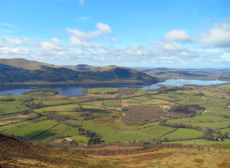 Naklejka premium Lake District fields with lake and clouds