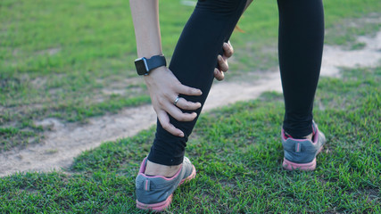 Fototapeta premium Calf leg injury accident in sport exercise running jogging.sprain or cramp Overtrained injured person when training exercising or running outdoors.