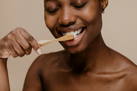 African Woman Brushing Teeth