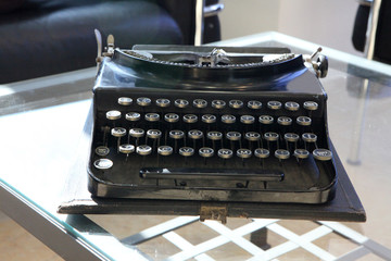 old typewriter with blank paper