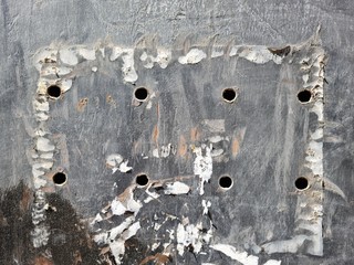 Rusty metal sheet panel in an urban environment