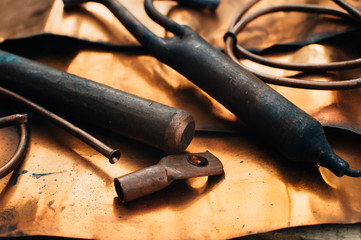 Copper scrap metal, copper sheets, copper spare parts and details. Copper texture. Close-up. Macro.