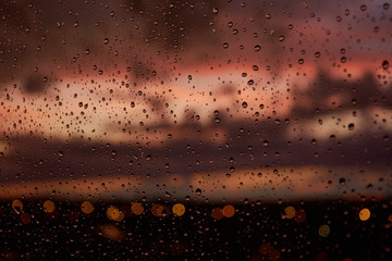 Water drops on a window, after a storm, during a sunset. Madrid. Spain