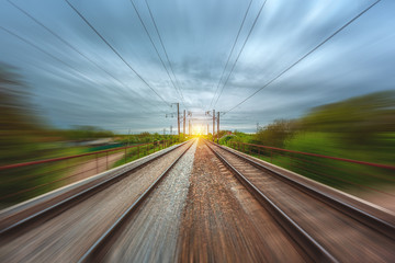 Fototapeta premium freight, passenger train moves with speed by rail