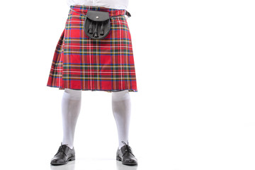 cropped view of Scottish man in red kilt with leather belt bag on white background - obrazy, fototapety, plakaty