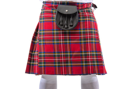 cropped view of Scottish man in red kilt with leather belt bag isolated on white