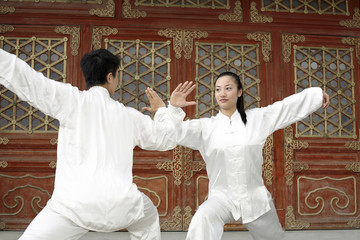 Man and woman practising martial arts