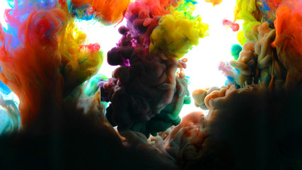 Color paint drops in water , abstract color mix , drop of Ink color mix paint falling on water...