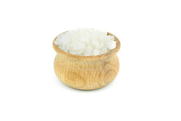 White sea salt in wood bowl, close up, isolated on white background.