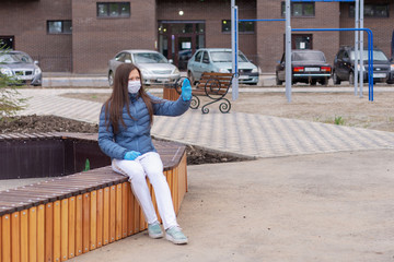 Covid concept 19. portrait of a Caucasian woman on the street and showing a stop gesture with her hand, the woman puts on a protective mask and gloves to prevent the rapid spread of the corona virus