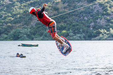 man doing water-skiing in nature. © javier