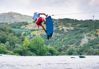 man doing water-skiing in nature. © javier