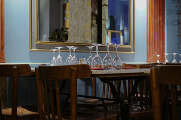 table in an empty restaurant. table with glasses and cutlery