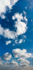 Fantastic clouds against blue sky, panorama
