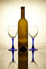 A bottle of wine and a glass glass