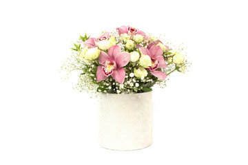 Beautiful bouquet of orchids, roses and gypsophila, Baby's-breath flowers in decorative paper tube packaging isolated on white, copy space. Selective focus, celebrating or delivery flower concept