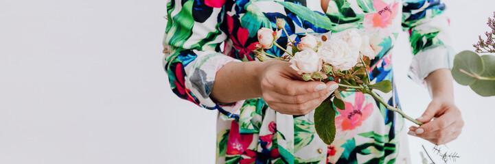 Florist arranging a bouquet of flower