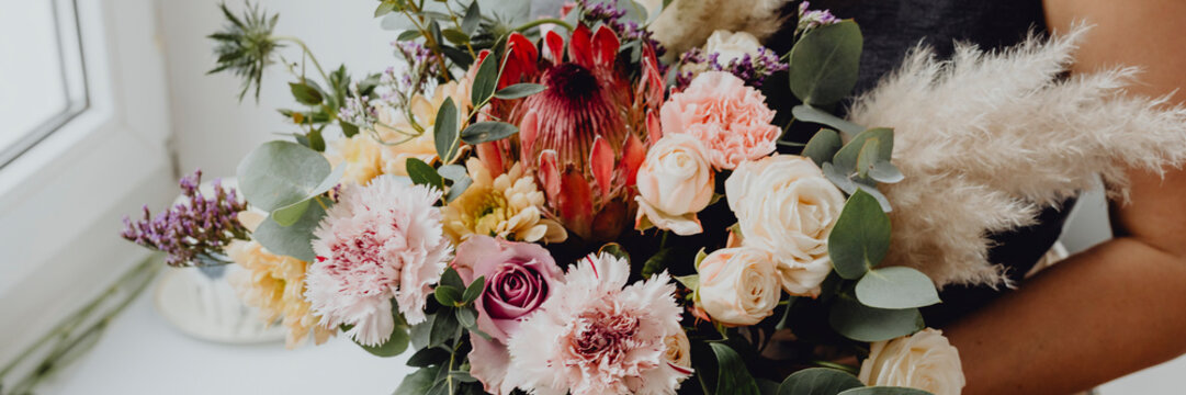 Woman Holding A Flower Bouquet