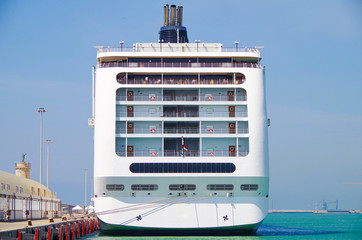 Stern or rear of MSC Cruises Cruiseship or cruise ship liner MSC Lirica in port of Civitavecchia, Italy, the gateway to eternal Rome during Mediterranean summer cruising	