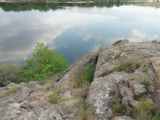 Amazing flowering spring vegetation makes even the old rocky bank of the Dnieper attractive for recreation.