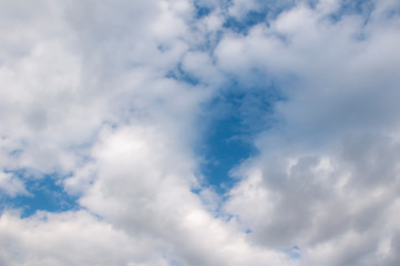 Fototapeta premium White clouds on a blue sky. Beautiful natural background.