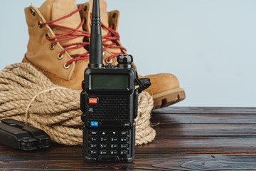 Equipment set for traveler including hiking boots and walki-talkie
