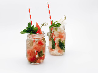 Summer refreshing cocktail with watermelon and mint on a white background