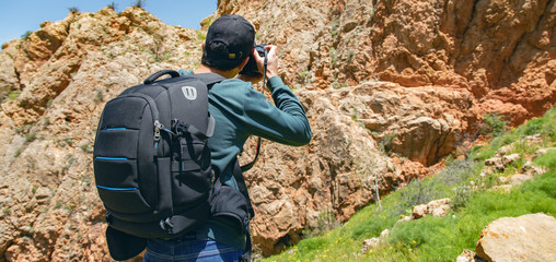 traveler hand photo camera in nature