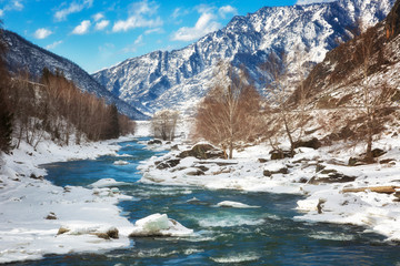 Winter landscape. River in Altai on a sunny day. Russia