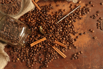 Still life with coffee beans and cinnamon in retro style