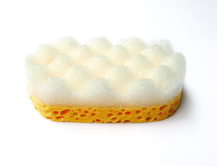 Obraz na płótnie Canvas Aerial view of Vegetal massage sponge with friction surface for exfoliating action isolated on white background. Natural care. Relaxing and toning skin bath accessory.