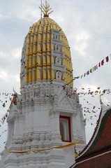 Prang of the golden-white Wat Phra Si Ratana Mahathat in Phitsanulok