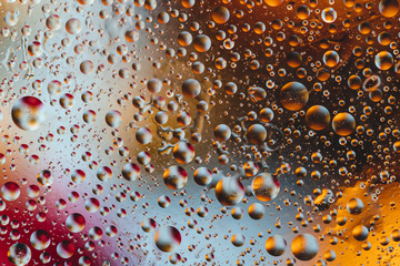 Drops on the glass. Background. Multicolored macro image. Space in small world