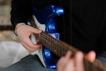 Fototapeta premium A hand on the guitar 