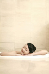 Woman relaxing in the bathtub