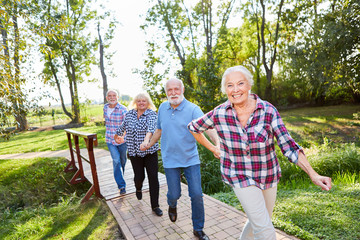 Senior group runs over a hiking trail