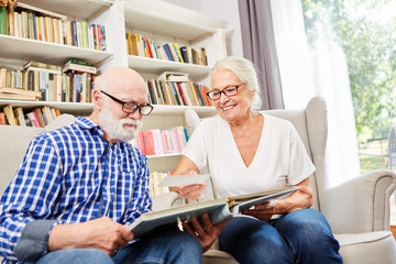 Couple of seniors looking at photos together