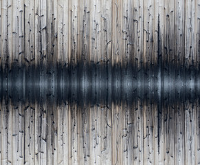 Grey color Pine tree timber plank in vertical line striped with black fire burned