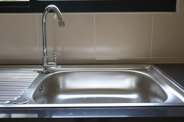 water faucet closed and empty stainless sink cooking in kitchen room