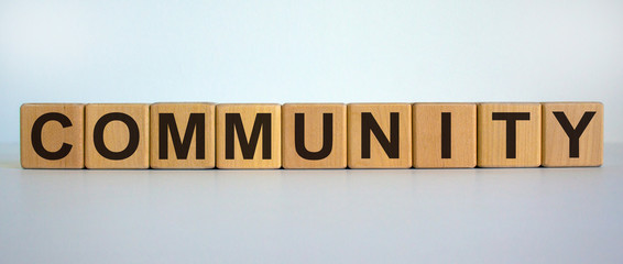 Concept word 'community' on cubes on a beautiful white background.