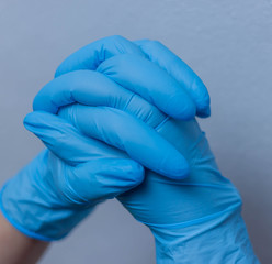 blue vinyl gloves on white background