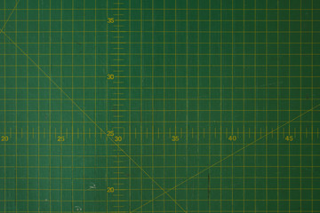 green cutting mat scale with scratch texture from cutter