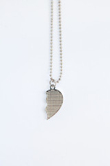 half heart locket on a white background