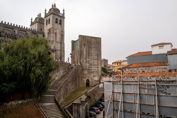 Porto Cathedral at the top of the stairs on the left and buildings under construction on the right.