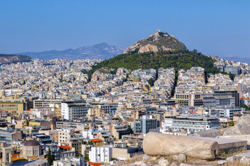 Athens, Greece, 08/11/2017 - View to the Lycabettus Hill from Acropolis in summer, at noon