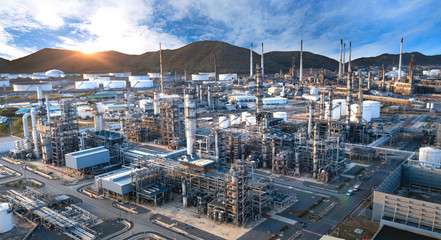 Close up Industrial view at oil refinery plant form industry zone with sunrise and cloudy sky, for banner space image.