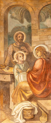 BARCELONA, SPAIN - MARCH 3, 2020: The fresco of Holy family in Nazareth in the church Parroquia Santa Teresa de l'Infant Jesus by Francisco Labarta (20. cent.).