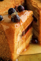honey cake decorated with black currant and with honey