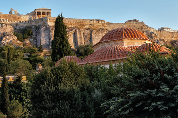 Acropolis and its surroundings at sunset - view from the street, in Athens, Greece